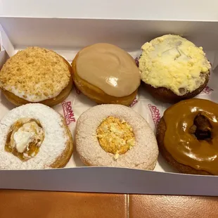 Lemon Up, Maple Cream, Pumpkin Cheesecake, Peaches-n-cream, Pumpkin pie, and Carmel Apple donuts (from top left to bottom right)