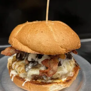 Magic Man
1/3rd lb Fresh All-Beef patty covered with Swiss and marinated portabellas