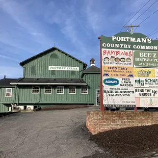 a sign for portman&apos;s country commons