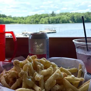 a basket of fries and a can of soda