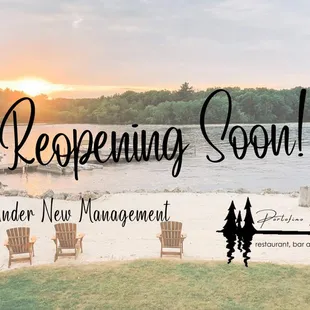 a view of a beach with chairs and a dock