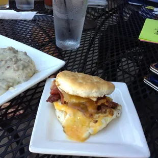 Breakfast sandwich and a peek of the biscuit and gravy, yum.