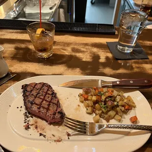 a plate of food and a glass of water