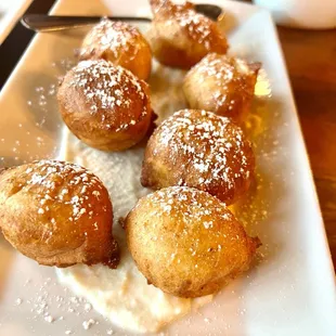 Zeppolis or Italian doughnuts with a pannacotta and citrus shmear.