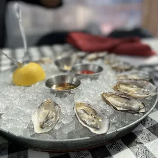 a platter of oysters on ice