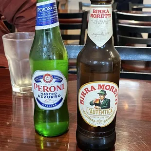 two bottles of beer on a table
