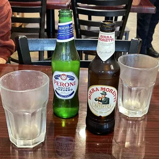 two bottles of beer and two glasses