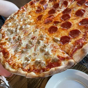 Half pepperoni half sausage pizza