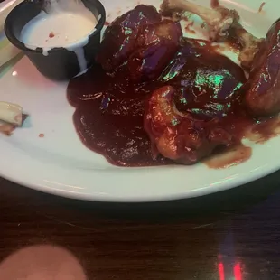 BBQ sauce with a side of wings.