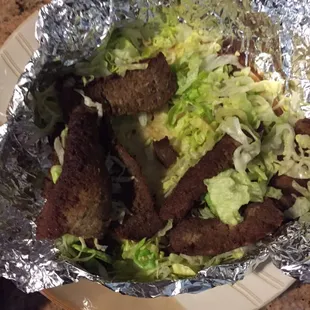 Gyro-with overdone meant and only shredded lettuce