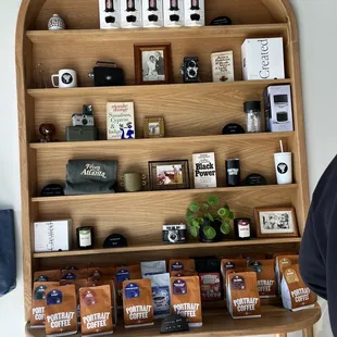 a shelf of coffee and teas