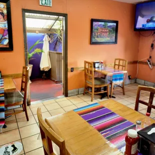 a dining area with tables and chairs