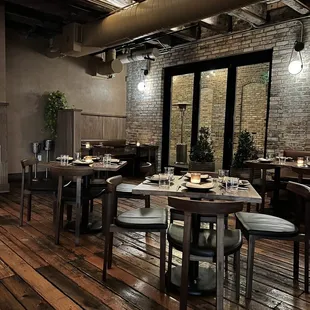 a dining room with wooden floors