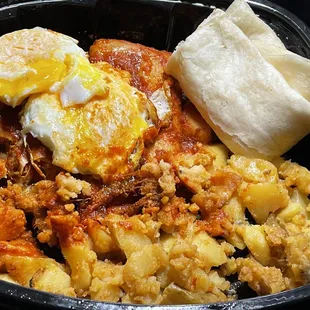 Red chile pork tamales with fried eggs and potatoes. Mmm...could of used some cheese but delicious anyway