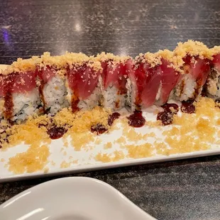 King Cake Roll -- coconut shrimp, cream cheese, tuna, eel sauce and crunchy.