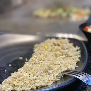 a plate of rice and vegetables