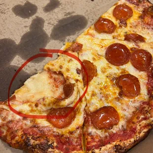 a slice of pepperoni pizza