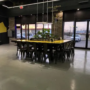 a dining room with a table and chairs