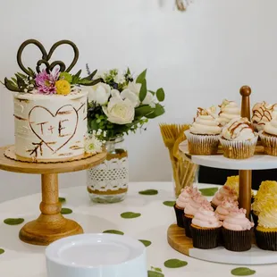 a table with cupcakes and cupcakes