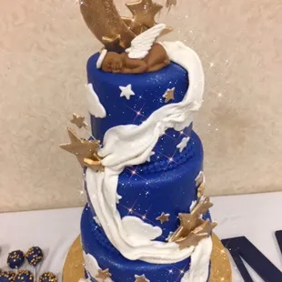 a blue and gold wedding cake