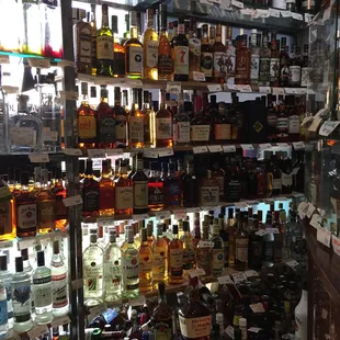 Front window is lined with bottles.