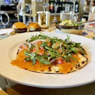 Smoked Salmon Focaccia ($8) arugula, capers, tomatoes, hummus