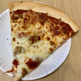 Sausage slice with added red pepper flakes.