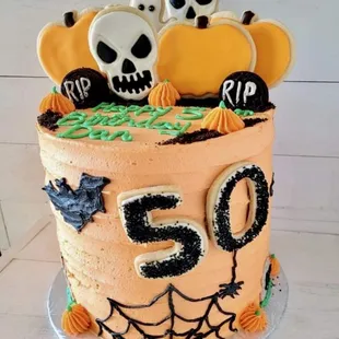 a cake decorated with halloween decorations