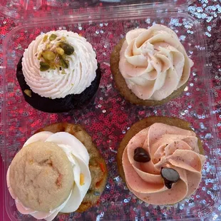 Chocolate Pistachio, Apple Pie Caramel Bourbon, Chocolate Chip Pumpkin, and Sprinkle Cupcake