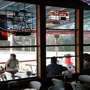 people sitting at tables in a restaurant