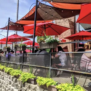outdoor seating with red umbrellas