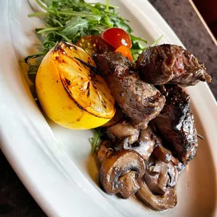 a plate of meat and vegetables