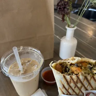 Vegan burrito with spiced jam, latte, and purchases. ;)