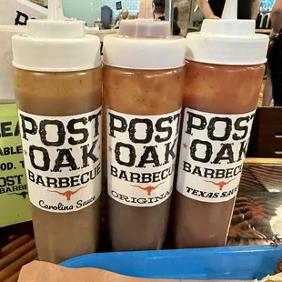 three bottles of barbecue barbecue sauce