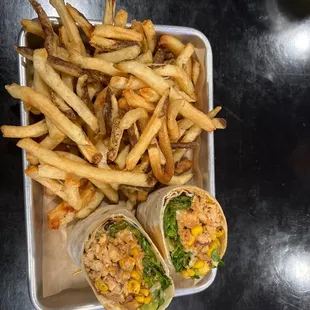 Chipotle chicken wrap with fries.