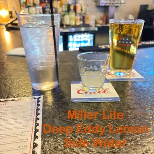 Deep Eddy Lemon Vodka Miller Lite Glass of water