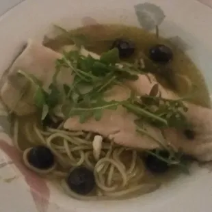 Trout, angel hair pasta, blueberries, and saffron lobster broth