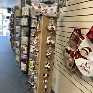 Keep your halls absolutely decked with these customized ornaments from Ganz, and featured independent local artists!
