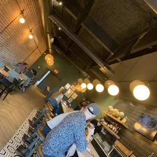 a woman standing at a bar