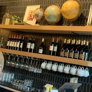 a man standing in front of a bar