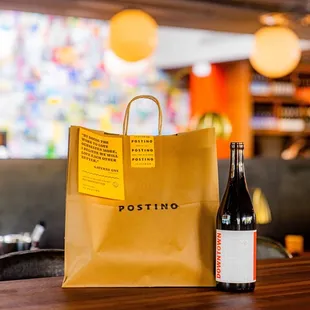 a bottle of wine and a paper bag