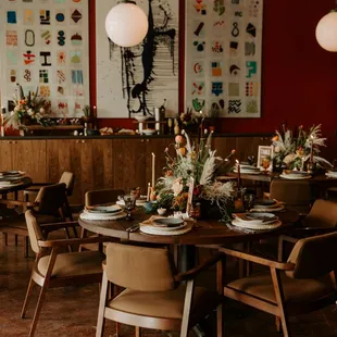 a dining room with tables and chairs