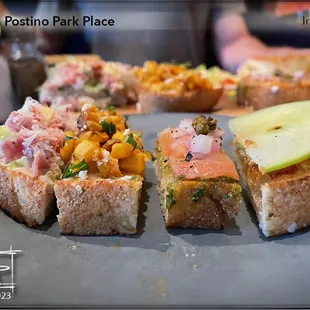 Bruschetta Board (Left to right) The Italiano, Mexican Street Corn, Smoked Salmon, Apple &amp; Fig