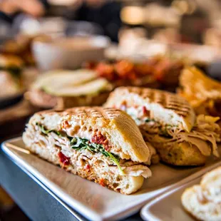 a plate of sandwiches and chips