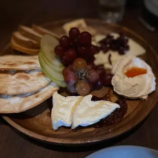 a plate of cheese and fruit