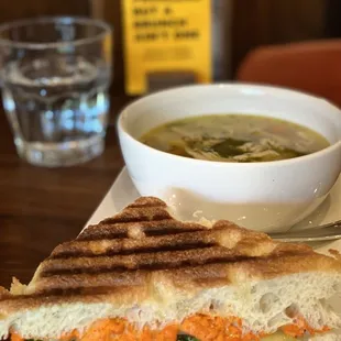 1/2 Crunchy vegetarian panini on focaccia bread with chicken noodle soup