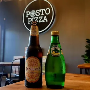 two bottles of beer on a table