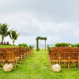 Ceremony setup! Aisle markers and arch decor