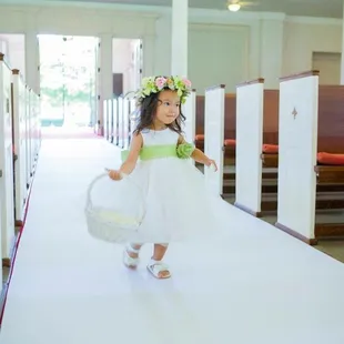 flower girl walking the aisle