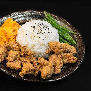  plate of food with rice, asparagus, asparagus, and